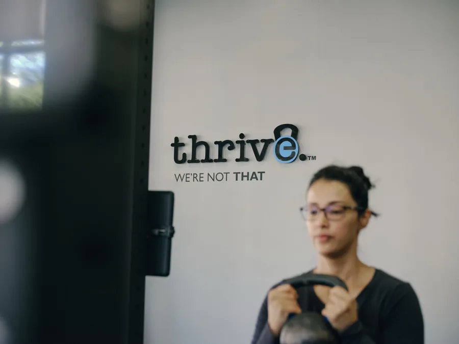 A member working with a kettlebell at Thrive Fit in The Beaches