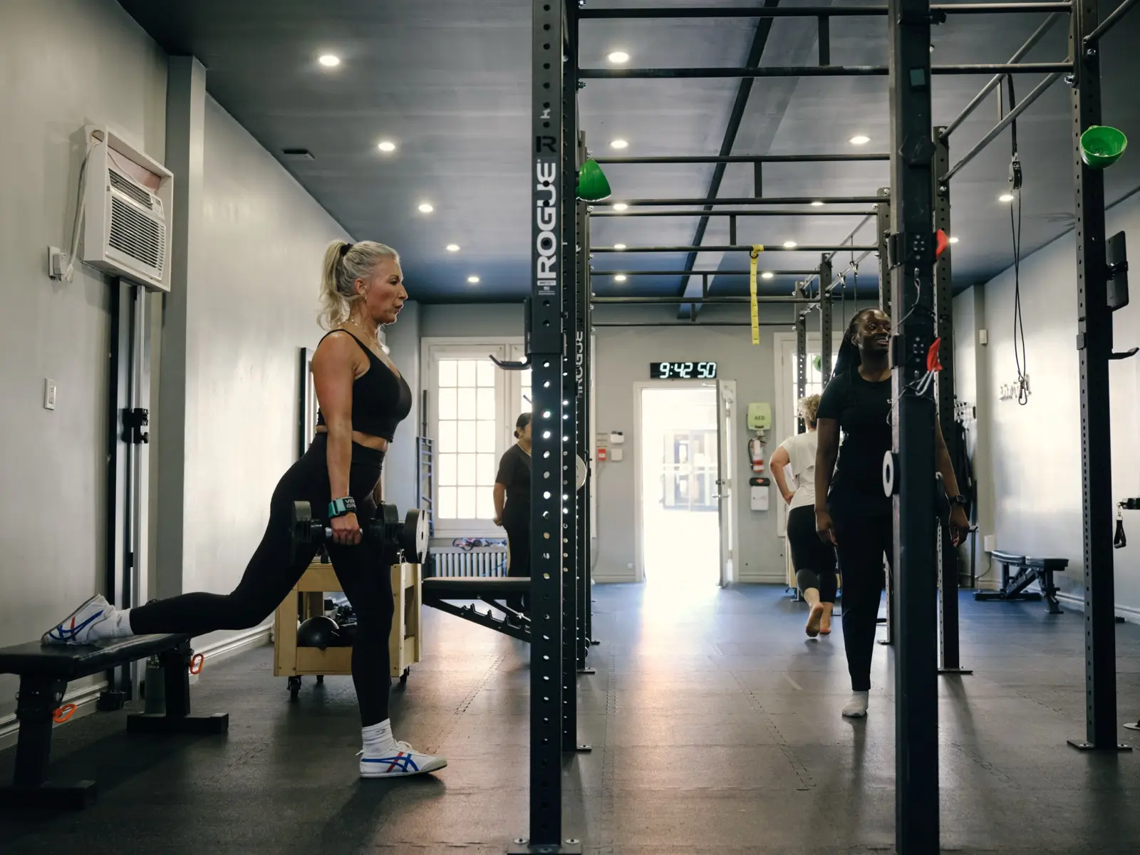 Thrive Fit: a member setting up for a lift