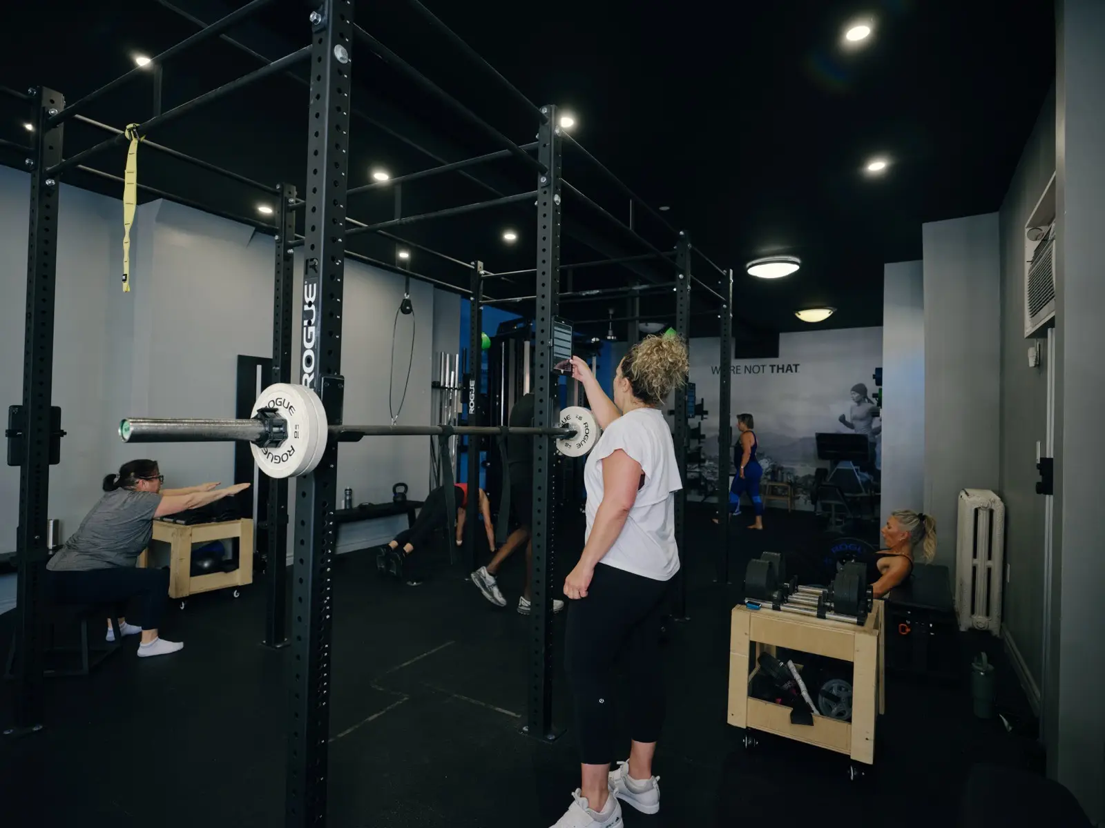 Thrive Fit: a member setting up for a lift